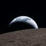Nasa’s Artemis crew snaps historic Earthset photo on way home from moon