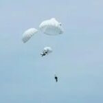 Chinese paratrooper saves unconscious comrade in dramatic mid-air chute emergency