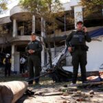Truck explodes outside Colombia police base, injuring 11 officers and killing a dog