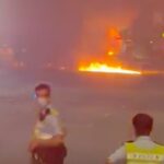 Truck driver flees after vehicle crashes and bursts into flames on Lantau highway